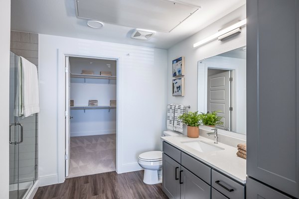 Elegant bathroom featuring modern fixtures at Starling at Bridgeland Apartments