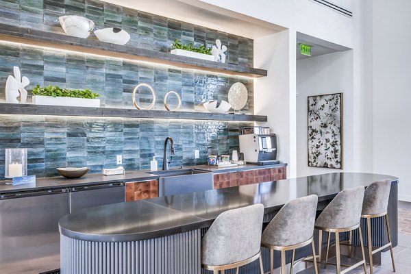 Clubhouse featuring modern decor and spacious seating at Starling at Bridgeland Apartments