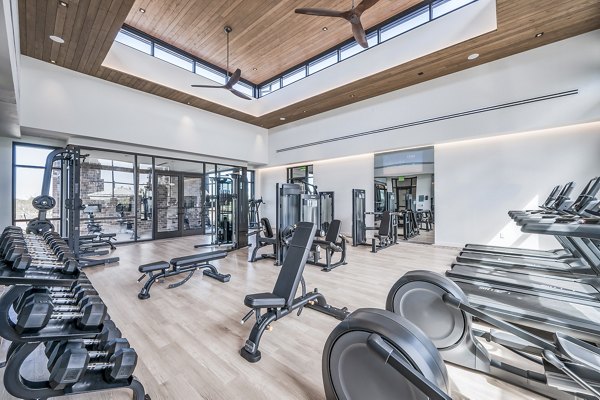 State-of-the-art fitness center with modern equipment at Starling at Bridgeland Apartments to enhance your workout experience