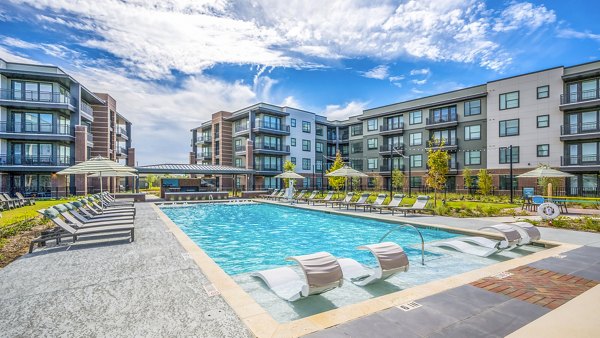 Resort-style pool with sundeck at Starling at Bridgeland Apartments, a luxury community
