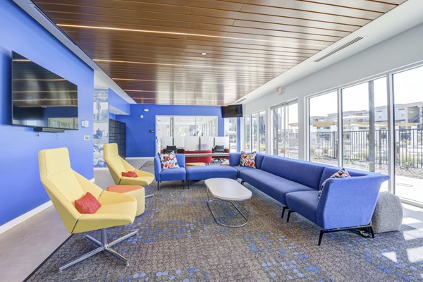 Modern clubhouse with chic seating and natural light at FLATZ 520 Apartments