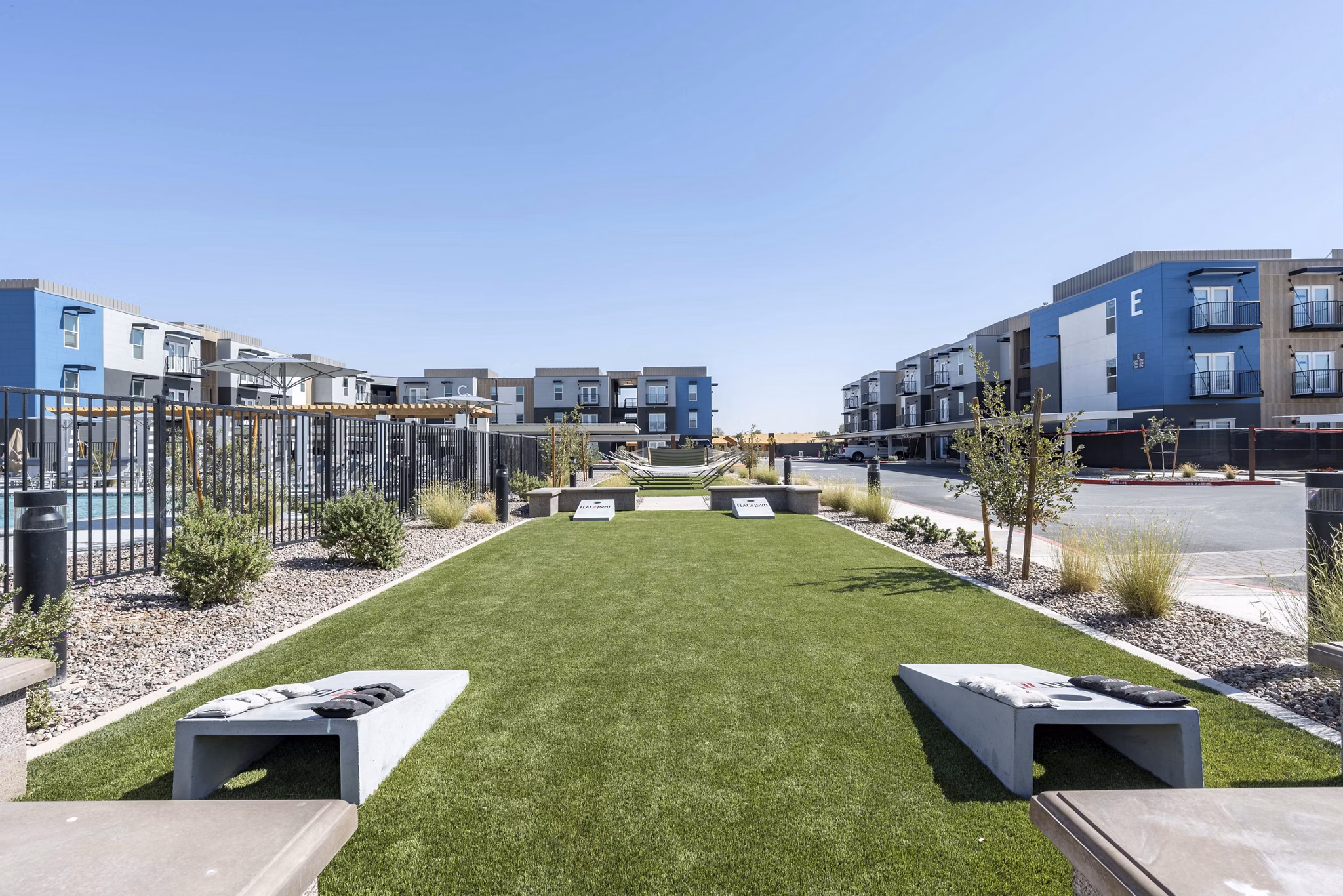 Charming courtyard with lush landscaping at FLATZ 520 Apartments