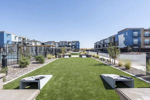 Charming courtyard with lush landscaping at FLATZ 520 Apartments
