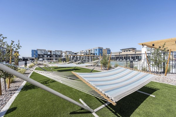Courtyard with modern seating and lush landscaping at FLATZ 520 Apartments