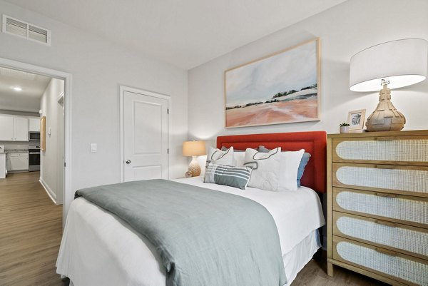 Cozy bedroom featuring modern decor at Maple Grove Apartments