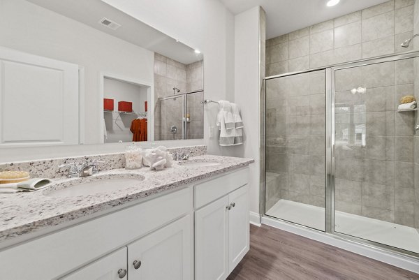 Modern bathroom with sleek fixtures at Maple Grove Apartments