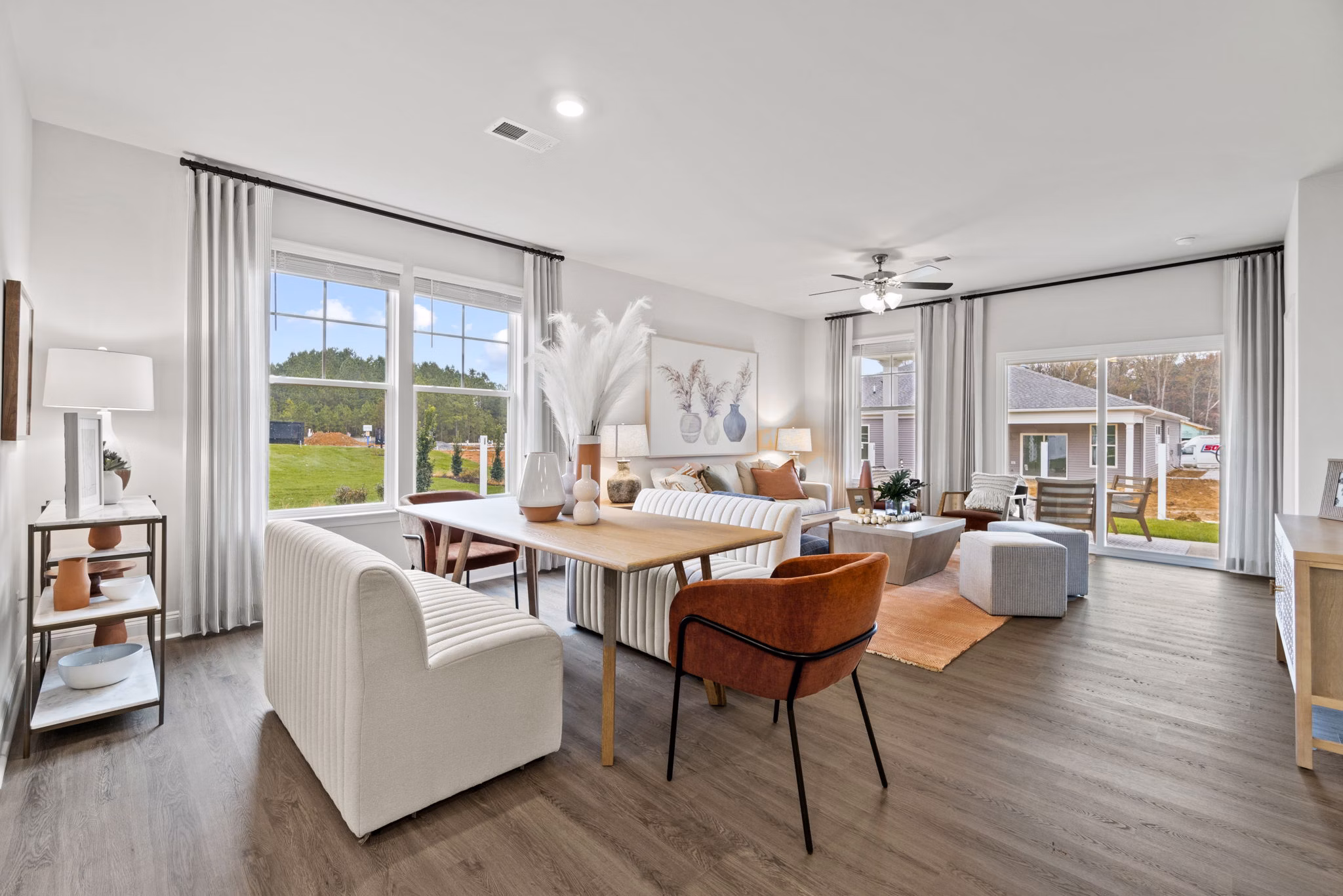 Dining area with modern furniture at Maple Grove Apartments: Luxury living by Greystar