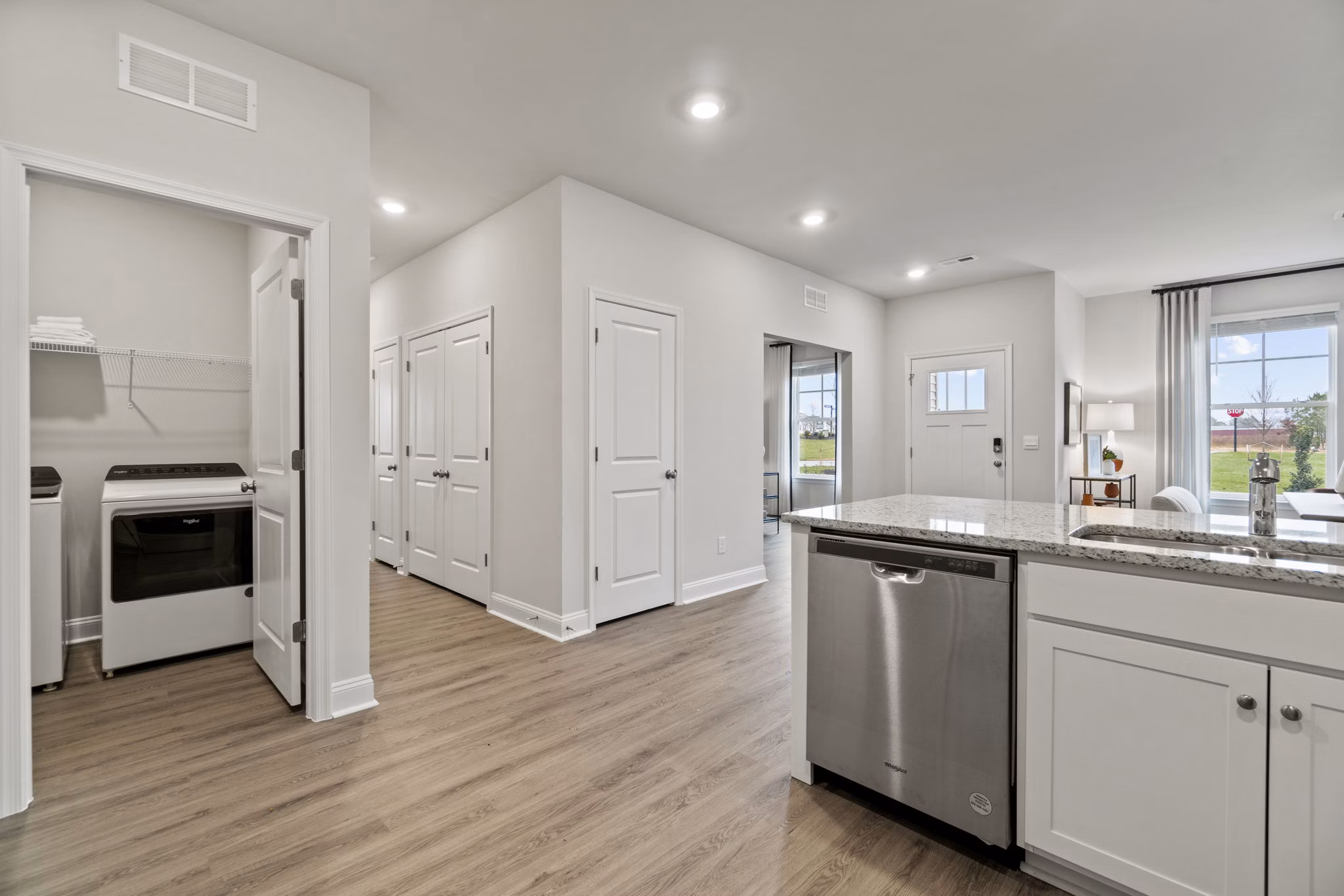 Modern kitchen with stainless steel appliances in Maple Grove Apartments