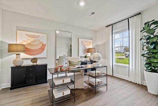 Stylish kitchen with granite countertops and stainless steel appliances in Maple Grove Apartments