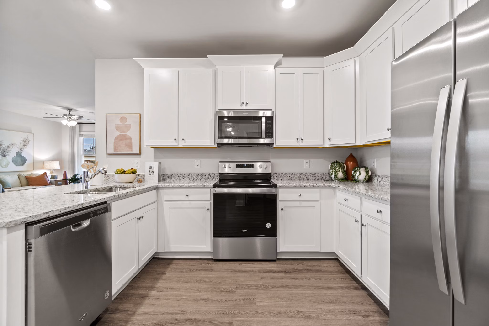 Kitchens with modern appliances at Maple Grove Apartments in luxury complex