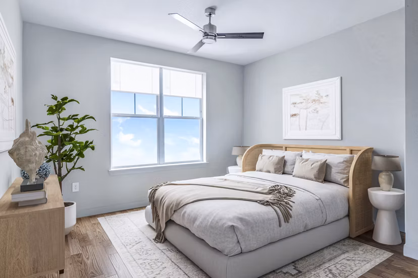 Cozy bedroom with modern furnishings in Birchway Hudson Oaks Apartments