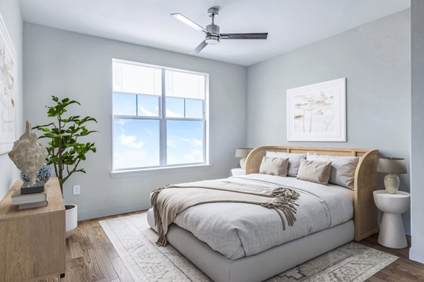 Cozy bedroom with modern furnishings in Birchway Hudson Oaks Apartments