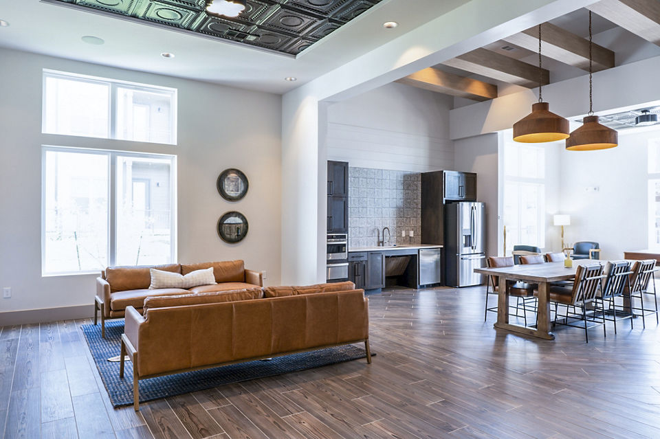 Stylish clubhouse lobby with modern seating at Birchway Hudson Oaks Apartments