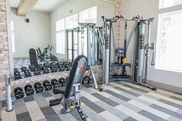 State-of-the-art fitness center at Birchway Hudson Oaks Apartments offering modern equipment and workout spaces