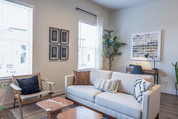 Birchway Hudson Oaks: Cozy living room with stylish furniture and natural light in luxury apartments