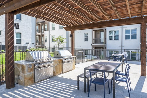 Grill area on a patio at Birchway Hudson Oaks Apartments ideal for outdoor gatherings
