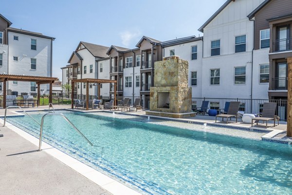 Luxurious pool at Birchway Hudson Oaks Apartments with modern design and spacious lounging areas