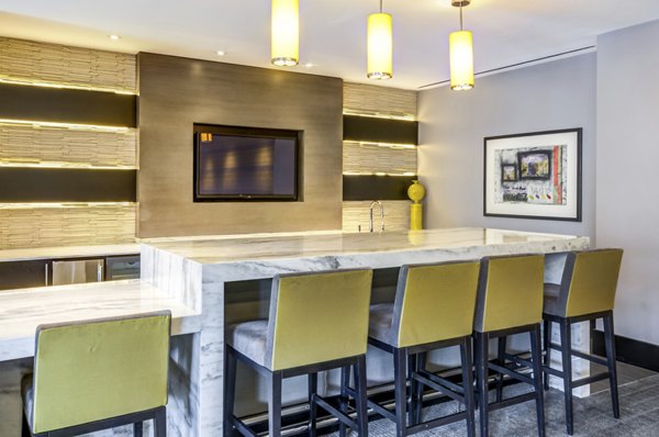 Clubhouse with modern design and seating areas at The Avant at Reston Town Center Apartments