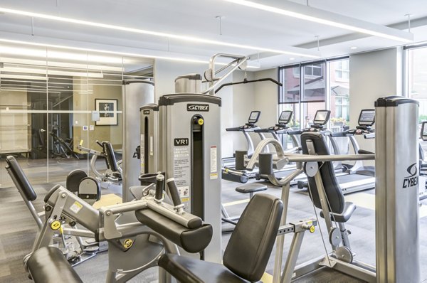State-of-the-art fitness center with modern equipment at The Avant at Reston Town Center Apartments Luxurious amenities for active residents
