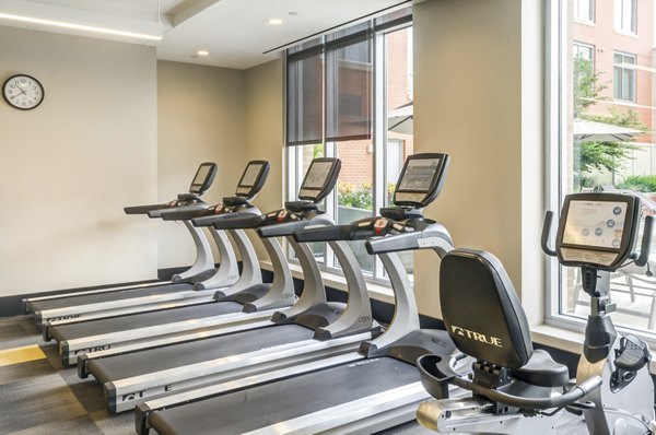State-of-the-art fitness center featuring modern gym equipment at The Avant at Reston Town Center Apartments