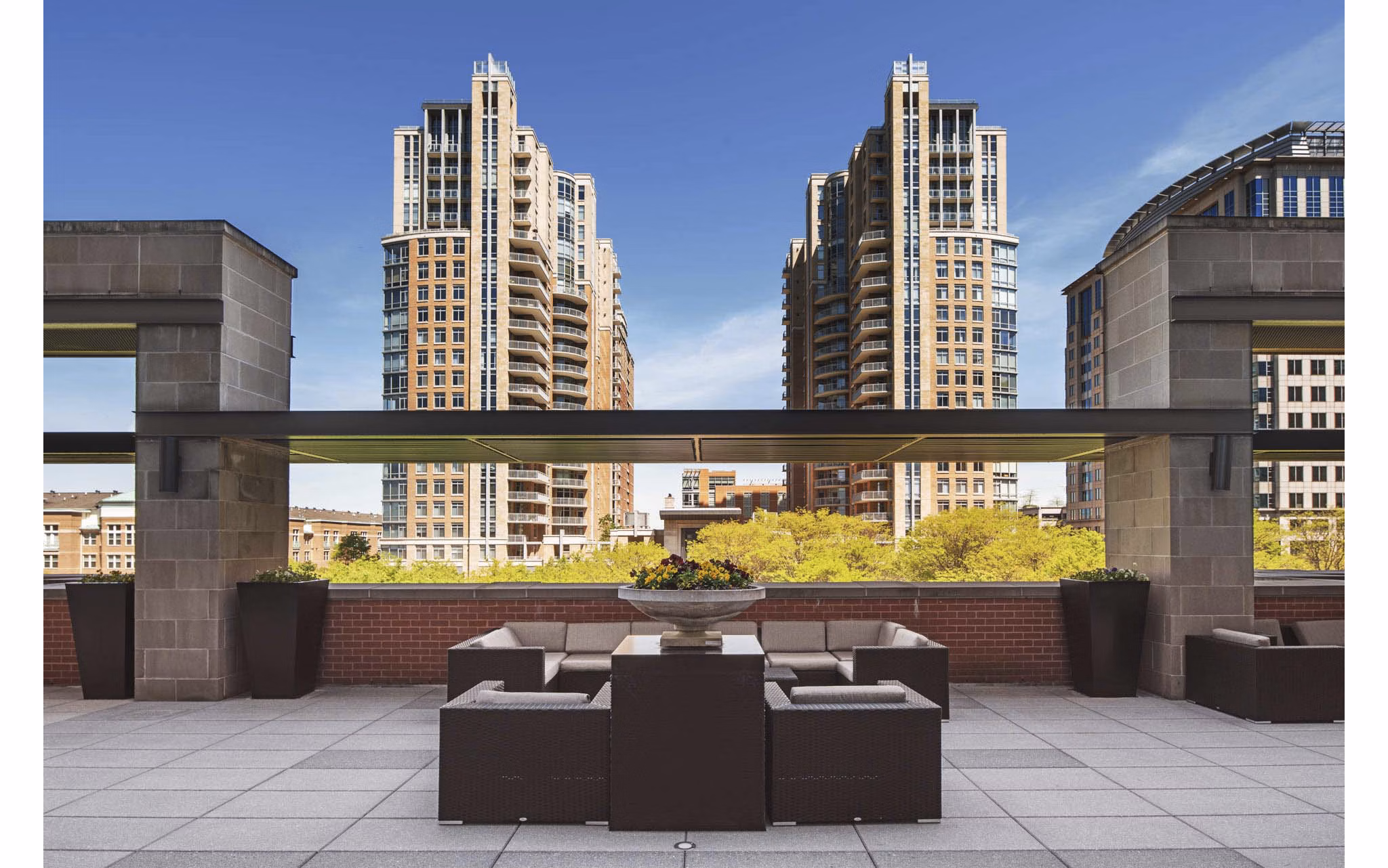 Courtyard with lush landscaping at The Avant at Reston Town Center Apartments, providing tranquil outdoor spaces for relaxation and socializing