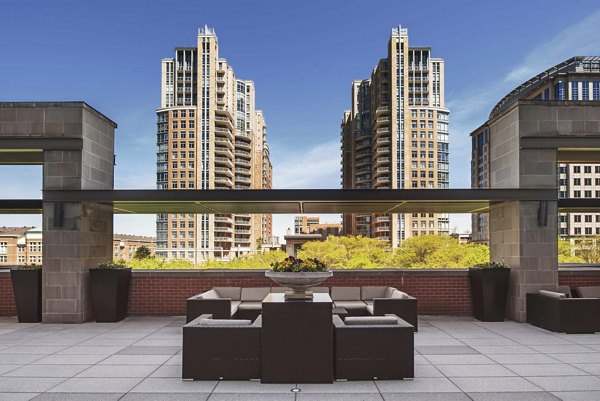 Courtyard with lush landscaping at The Avant at Reston Town Center Apartments, providing tranquil outdoor spaces for relaxation and socializing