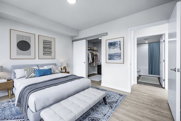 Cozy bedroom with modern furnishings at Ion Town Center Apartments
