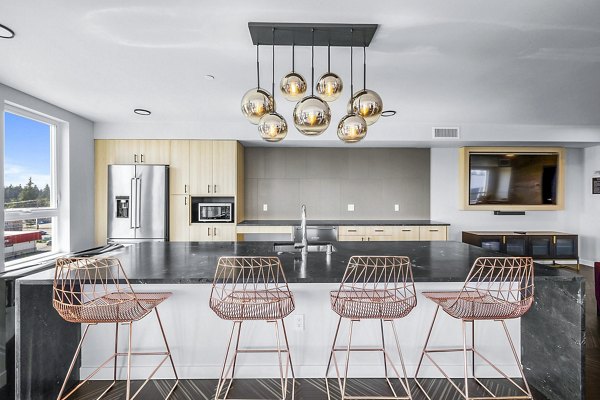 Clubhouse featuring modern design and comfortable seating at Ion Town Center Apartments