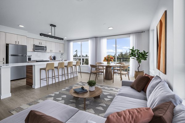 Spacious living room featuring modern decor at Ion Town Center Apartments