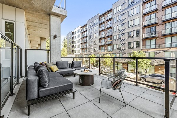 Ion Town Center Apartments: Modern patio with stylish seating and greenery, perfect for relaxation in a vibrant community setting