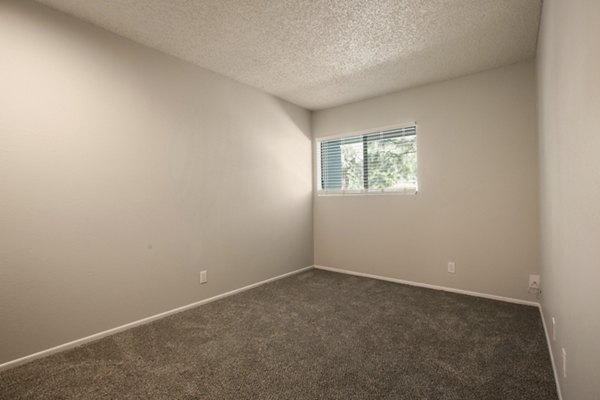 Cozy bedroom featuring modern design elements at Sun Plaza Apartments