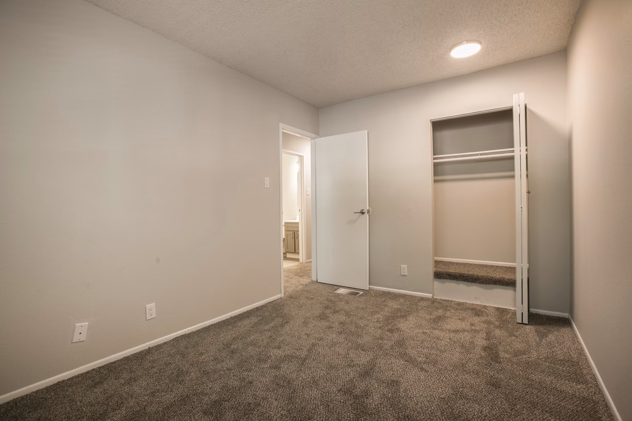 Cozy bedroom featuring modern decor at Sun Plaza Apartments, Greystar luxury apartments