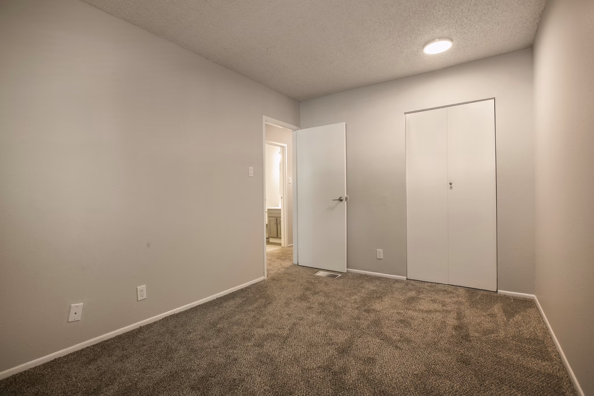Bedroom featuring elegant decor and modern furnishings at Sun Plaza Apartments