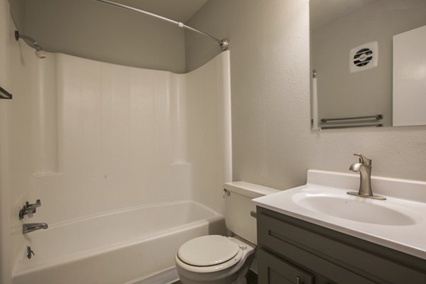 Modern bathroom with sleek fixtures at Sun Plaza Apartments, luxury living in a prime location
