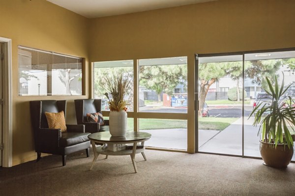 Clubhouse at Sun Plaza Apartments: Modern meeting space featuring comfortable seating and entertainment options for luxury living