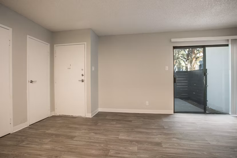 Stylish living room with modern dÃ©cor and natural light at Sun Plaza Apartments