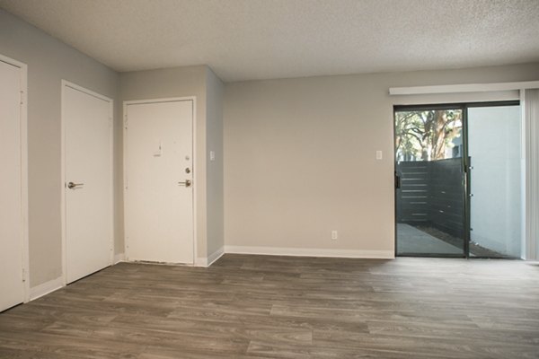 Stylish living room with modern dÃ©cor and natural light at Sun Plaza Apartments