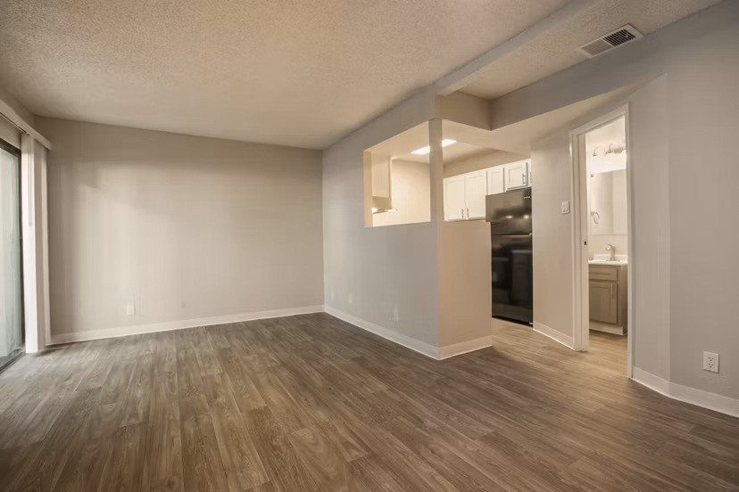 Spacious living room with modern furnishings in Sun Plaza Apartments, showcasing elegant interior design for luxury living