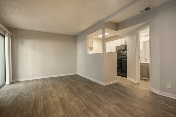 Spacious living room with modern furnishings in Sun Plaza Apartments, showcasing elegant interior design for luxury living