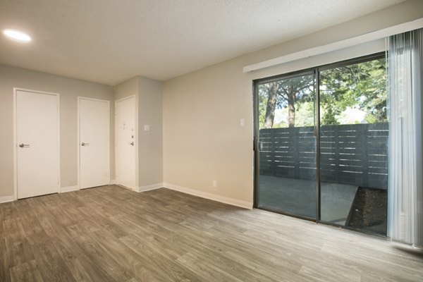 Spacious living room with modern decor at Sun Plaza Apartments, Greystar luxury apartments