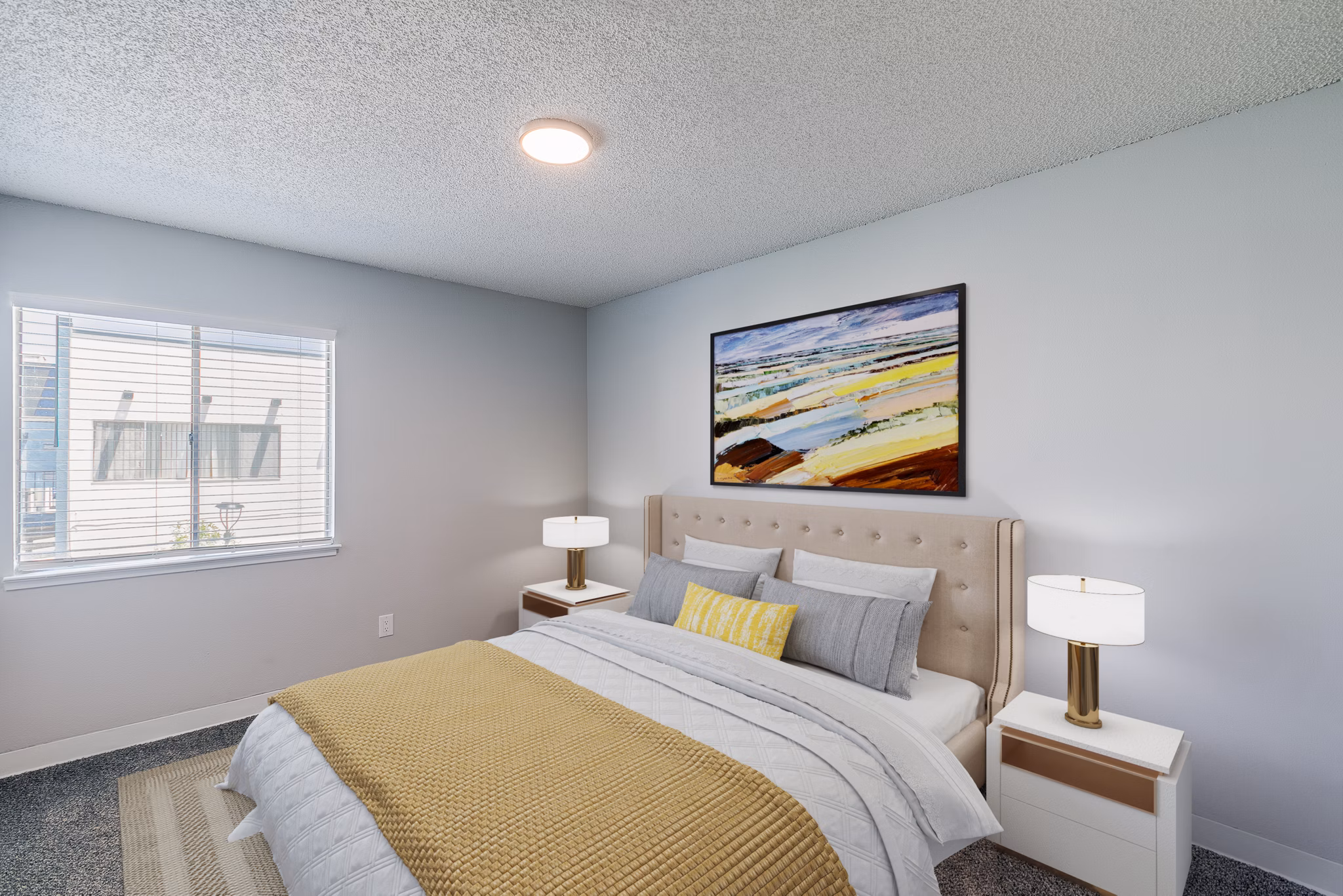 Cozy bedroom with modern decor and ample natural light at Valley Apartments