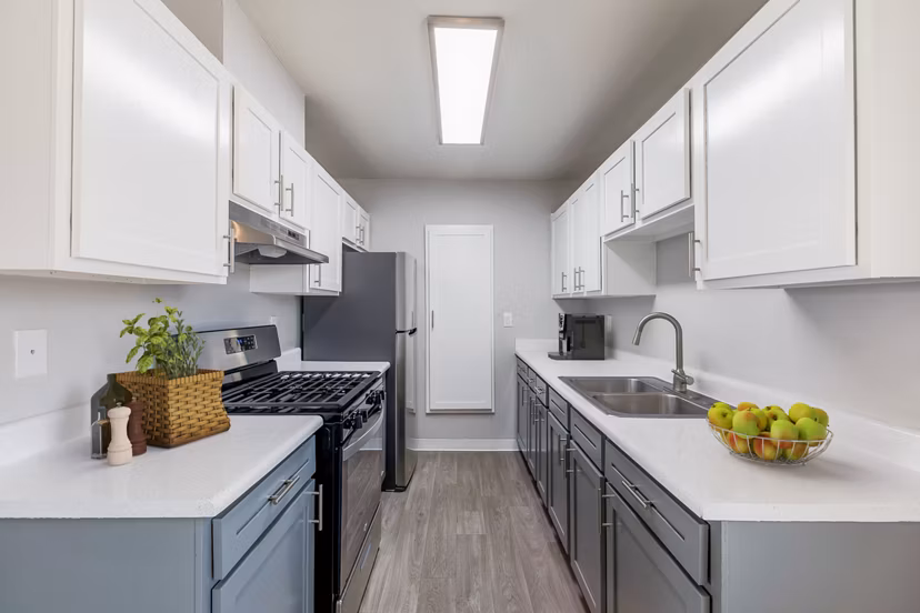 Valley Heights: Modern kitchen with stainless steel appliances and granite countertops at luxury apartments