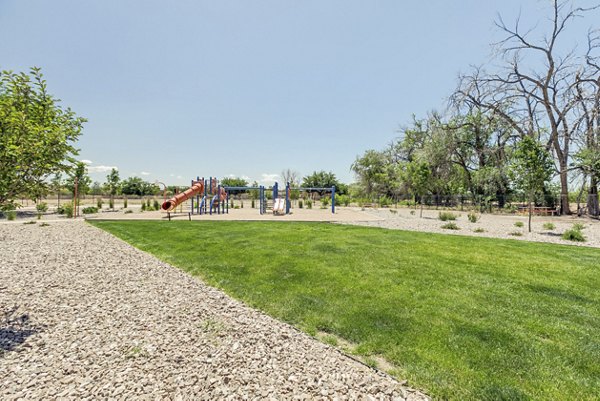 Spacious playground with colorful equipment at Valley Apartments, perfect for families and residents seeking active outdoor fun