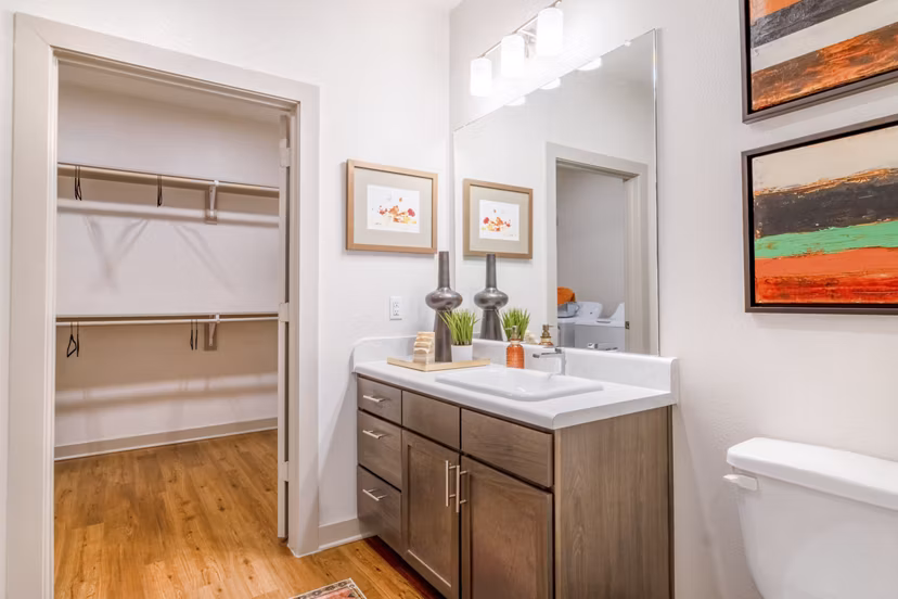 Modern bathroom with sleek fixtures and spacious vanity in Espria Apartments