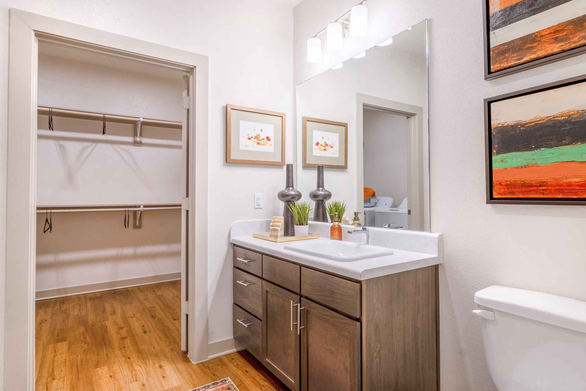 Modern bathroom with sleek fixtures and spacious vanity in Espria Apartments