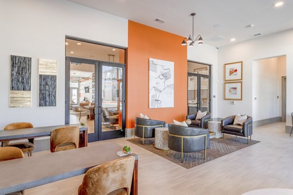 Modern clubhouse with plush seating and entertainment options at Espria Apartments luxury community