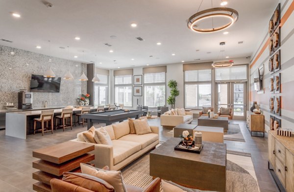 Contemporary clubhouse with modern furnishings at Espria Apartments