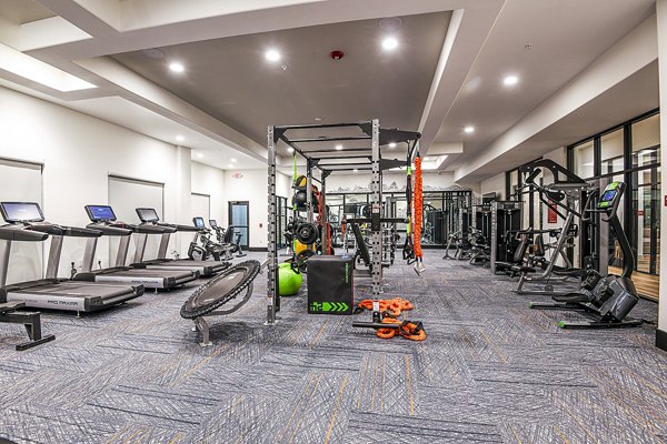 fitness center at The Henry Apartments