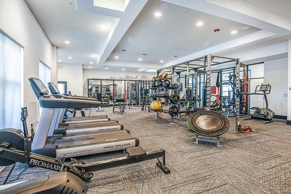 fitness center at The Henry Apartments