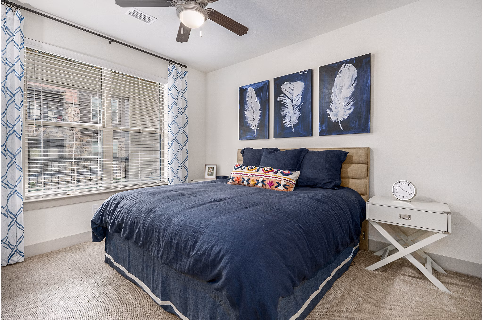 Elegant bedroom with modern furnishings at Peak 83 luxury apartments, showcasing stylish design elements for ultimate comfort and relaxation